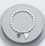 Elasticated bracelet with silver and rose gold beads - with a grey charm and battered heart motif