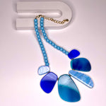 Short necklace, with various blue detail and baby blue beading