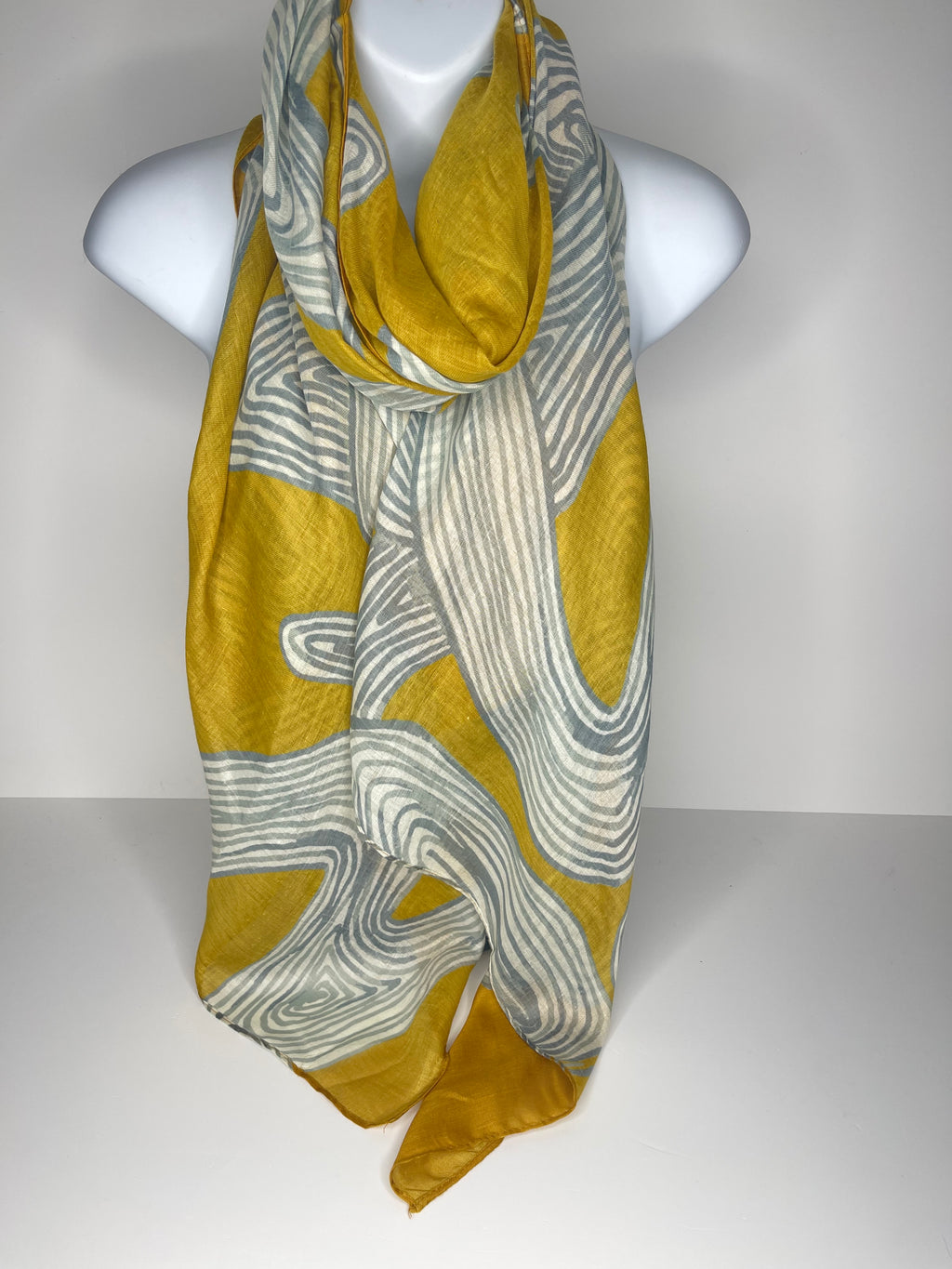 Lighter weight abstract grey and cream print scarf in shades of mustard