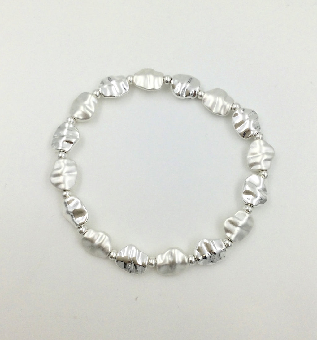 Elasticated bracelet with matte silver and shiny silver battered circular stations