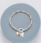 Elasticated bracelet with beading and squares, silver and rose gold heart motif