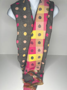 Winter weight, wool-mix, reversible, polka-dot print scarf in shades of grey, raspberry, yellow and blush pink