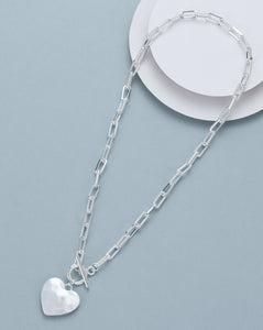 Short necklace, with battered matte silver heart pendant and push-through open/close  - on a silver paper chain