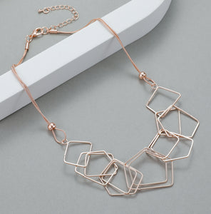 Short necklace, with interlinked squares - on a rose gold chain