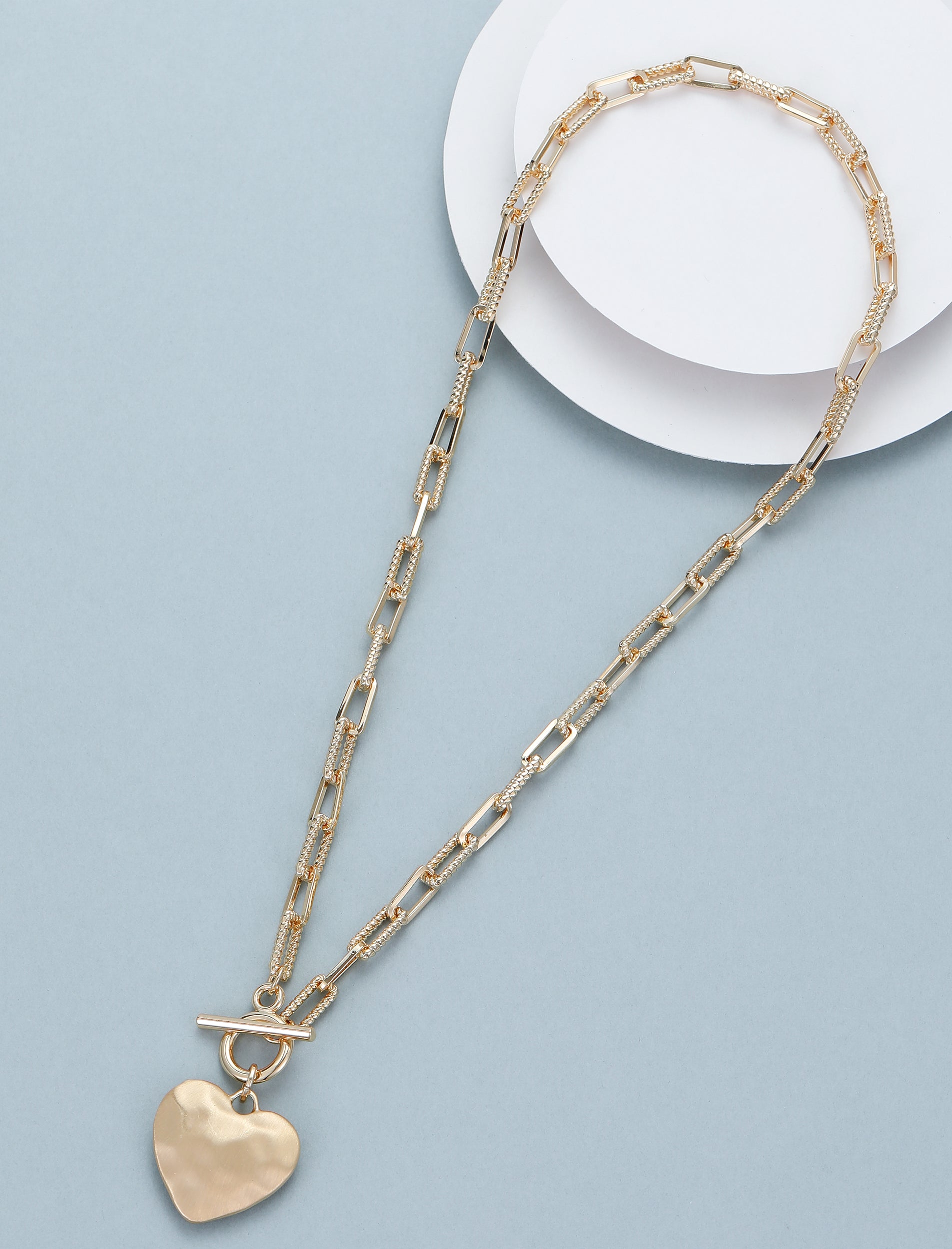 Short necklace, with battered matte gold heart pendant and push-through open/close  - on a gold paper chain
