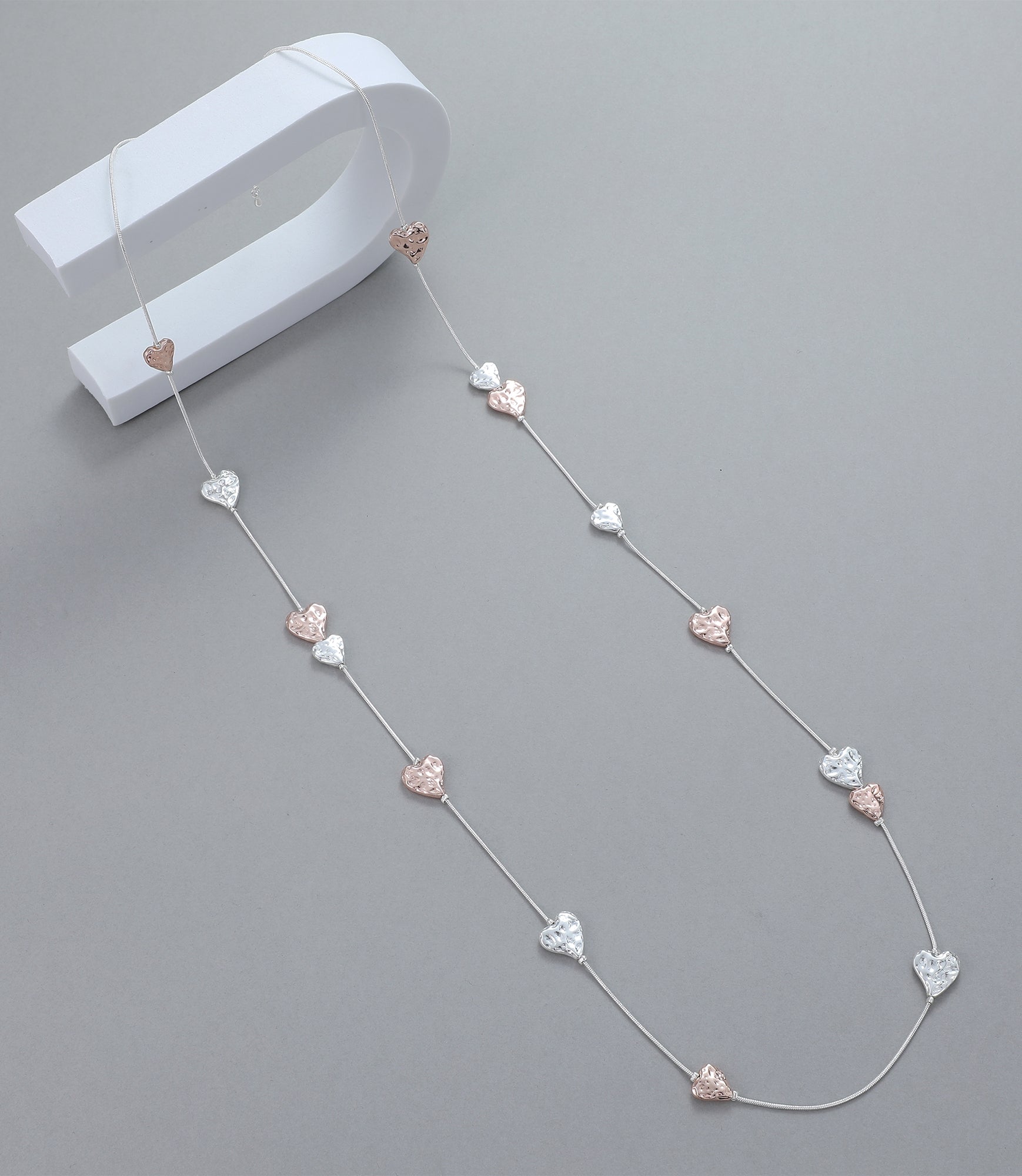 Long necklace, with battered rose gold and silver heart stations - on a silver chain