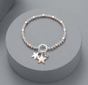Two-tone elasticated bracelet with star motif