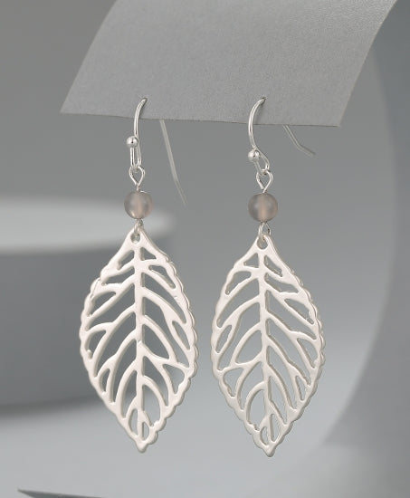 Open leaf design earrings in silver tone