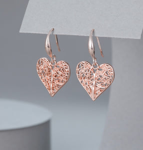 Battered open heart design earrings in rose gold tone