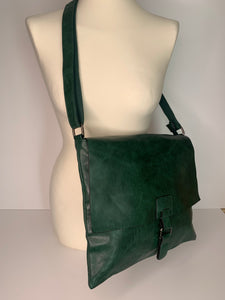 Vegan leather, cross-body satchel bag with top zip, magnetic dot closure and adjustable strap in forest green